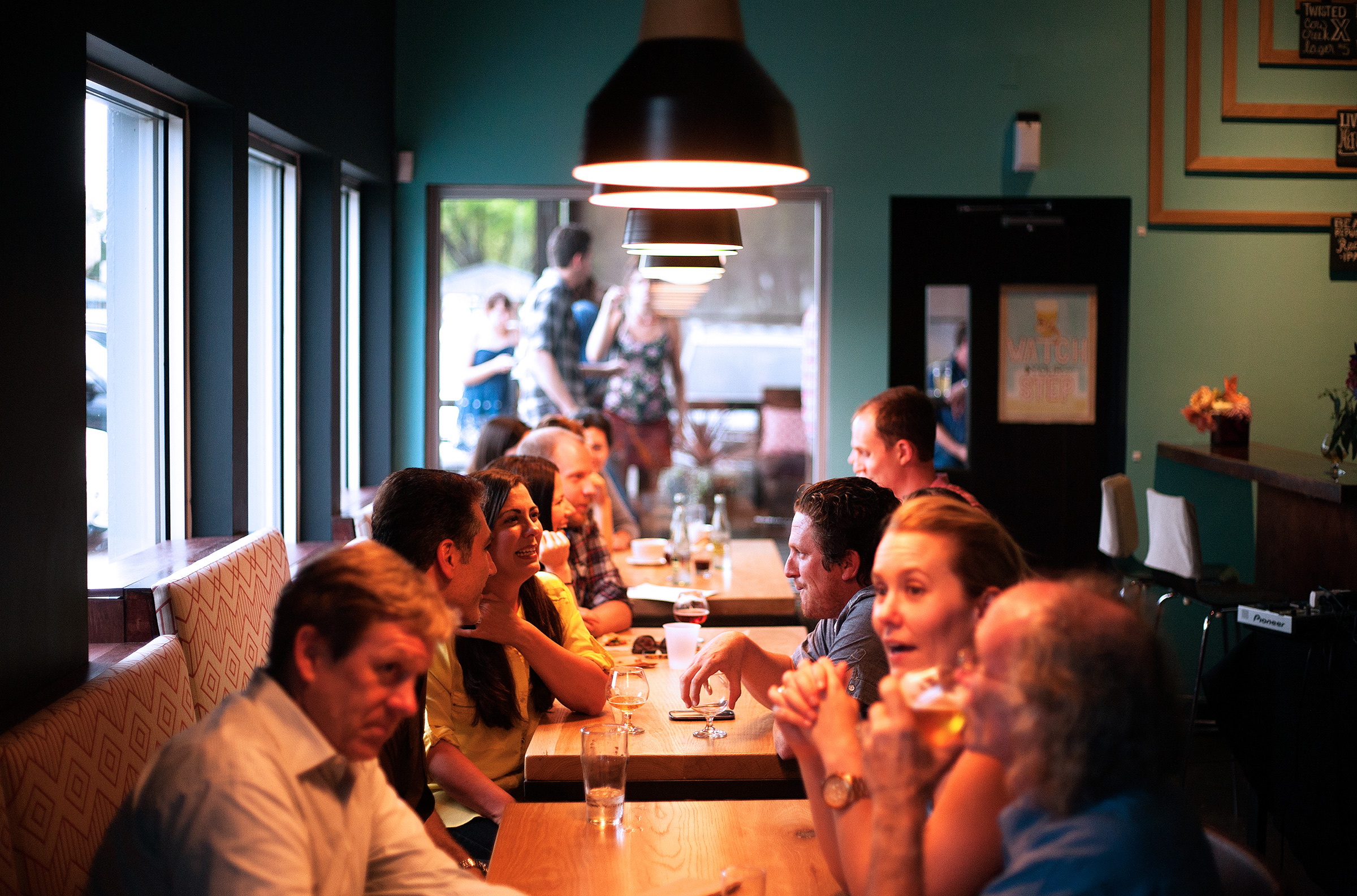 people at a cafe sitting and waiting/enjoying the food